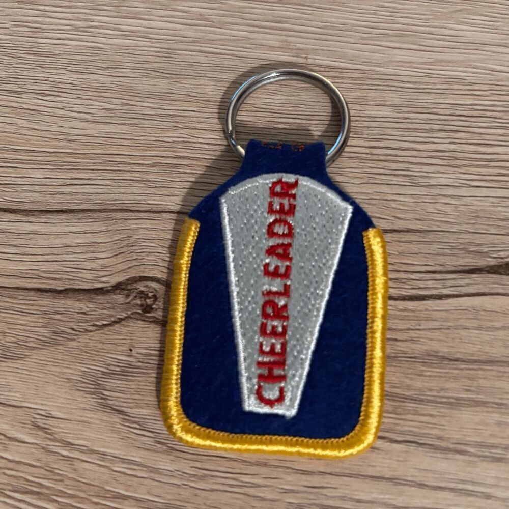 International Cheerleading Foundation Vintage feltโembroidered keychain blue